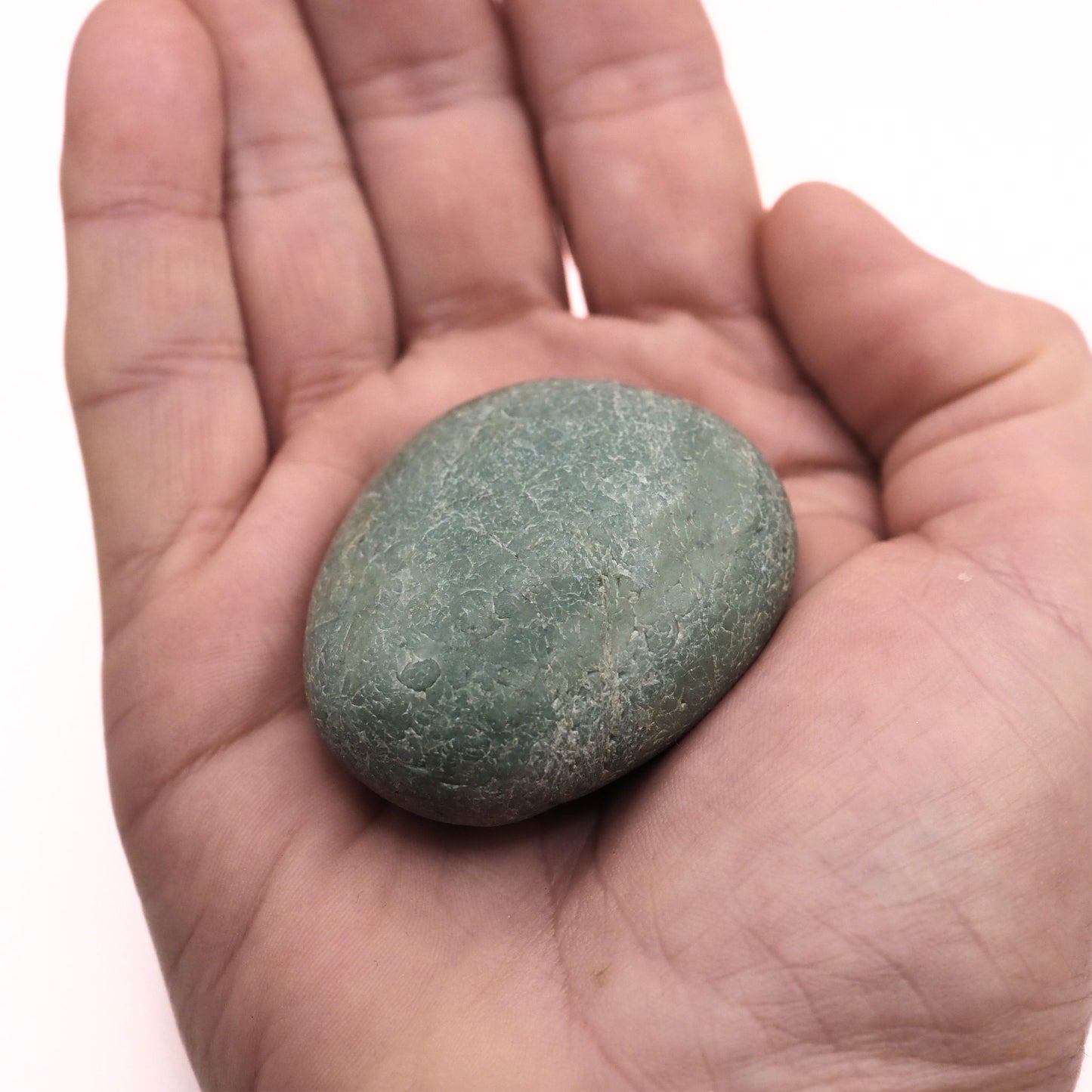 Green Jasper palm stone in hand